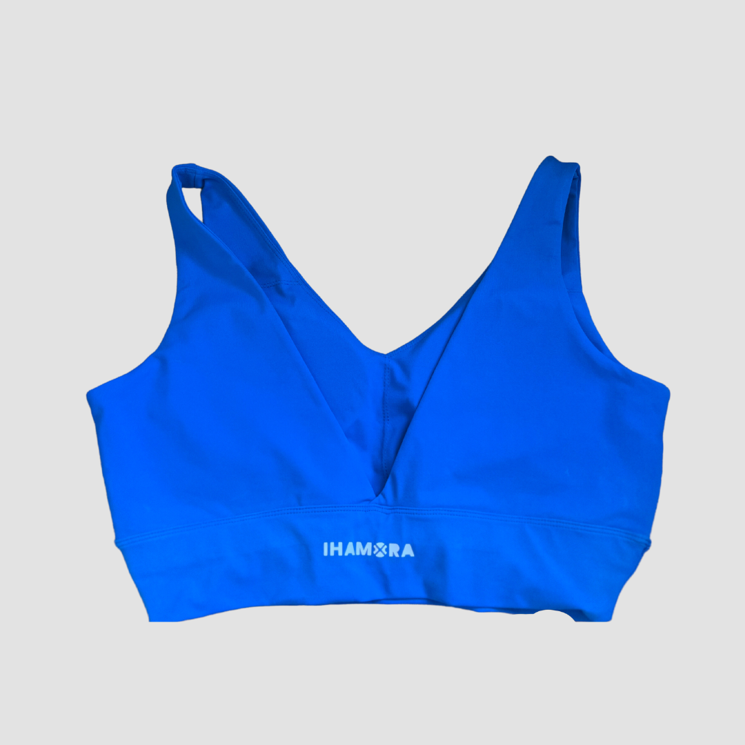 A blue V-neck sports bra with the brand name 'IHAMORA' written across the back.