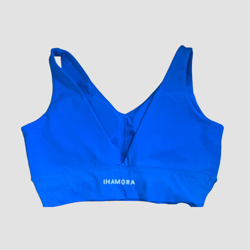 A blue V-neck sports bra with the brand name 'IHAMORA' written across the back.
