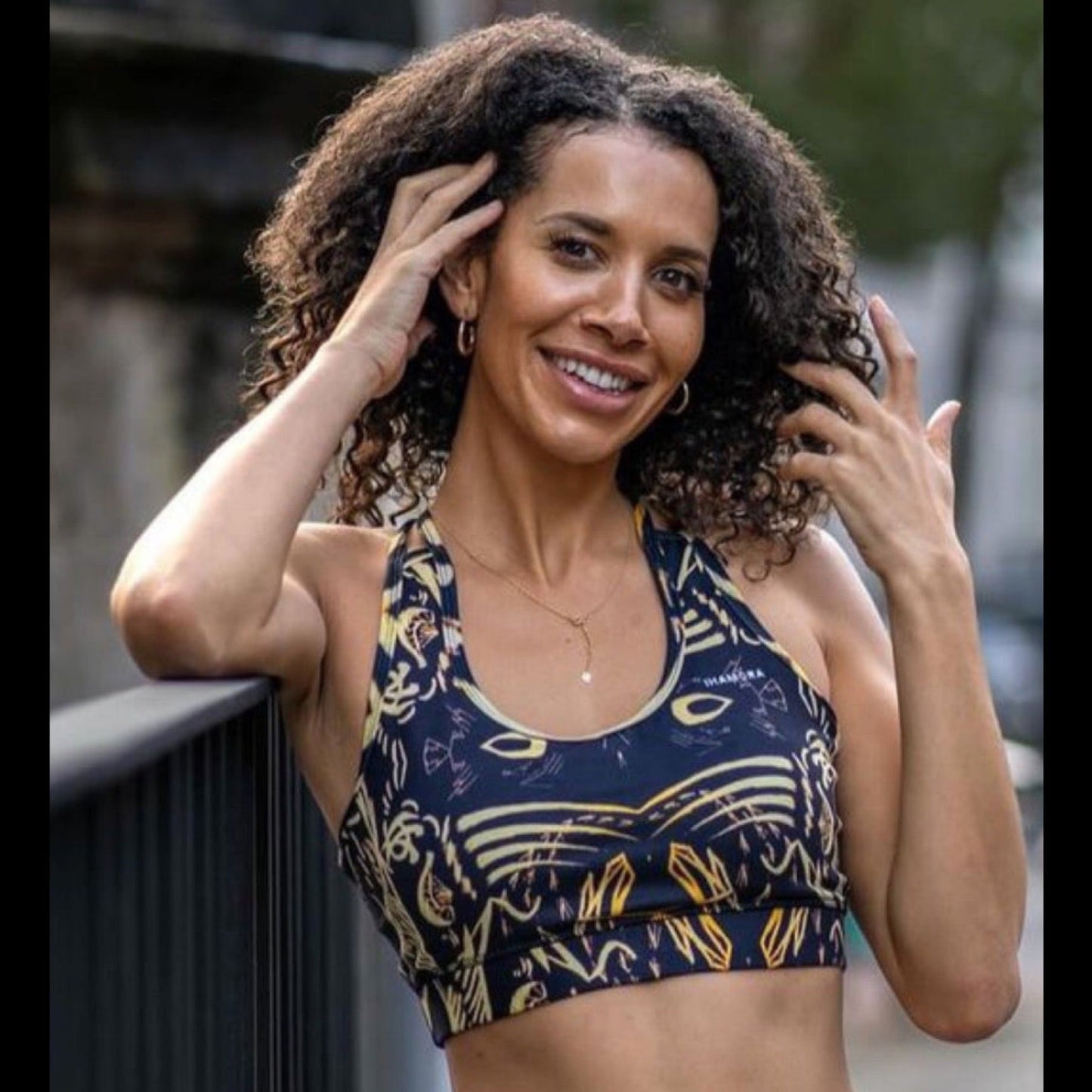 Woman wearing a patterned sports bra outdoors