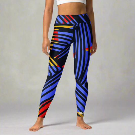 Saber print seamless high-waisted leggings, limited edition IHAMORA activewear XS–4XL. Woman wearing colorful striped leggings on a multicolored geometric background