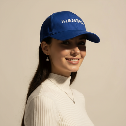 Woman wearing a blue cap with 'IHAMORA branding against a beige background