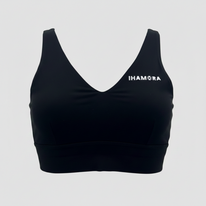 Black sports bra with 'IHAMORA' logo on a light gray background