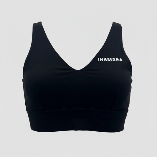 Black sports bra with 'IHAMORA' logo on a light gray background