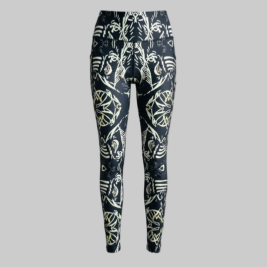 Black leggings with white and yellow abstract pattern on a white background