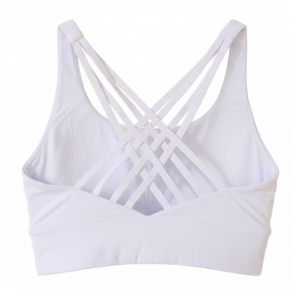 White sports bra with criss-cross straps on a white background