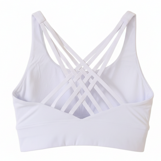 White sports bra with criss-cross straps on a white background