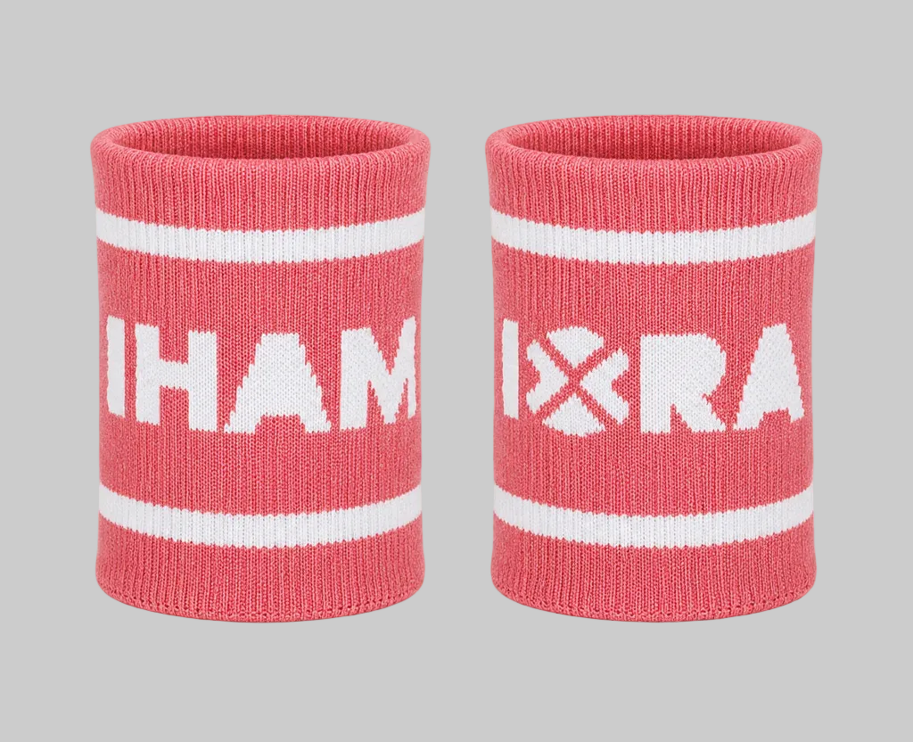 Two pink wristbands with white text and stripes on a white background