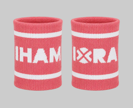 Two pink wristbands with white text and stripes on a white background