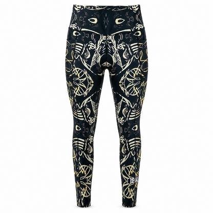 Black leggings with gold animal pattern on a white background