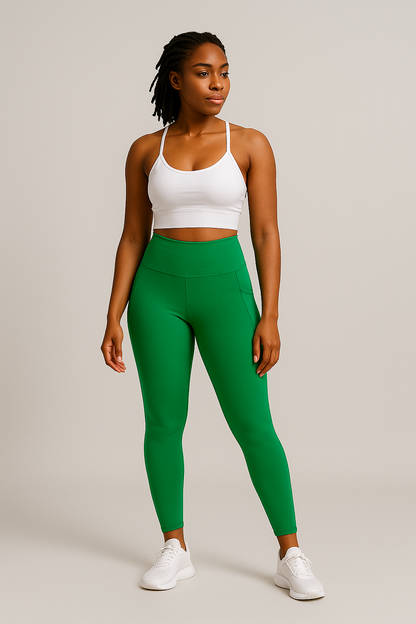 Woman wearing High-waisted vibrant green leggings with pockets on the sides, designed for comfort and style.HAMORA activewear XS–XL