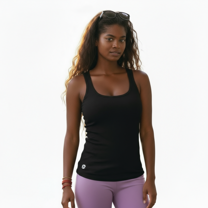 Woman wearing a black tank top and purple leggings on a white background