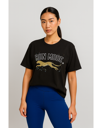 Woman wearing a black t-shirt with 'RUN MODE' and a leaping cat graphic on a plain background and IHAMORA Icon