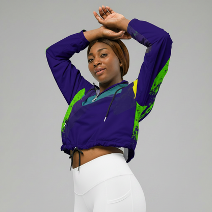 Woman wearing a purple and green jacket with pink pants on a white background