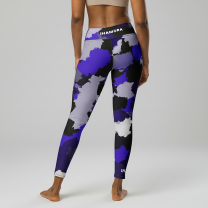 Person wearing purple camouflage leggings with 'IHAMORA' branding on a white background