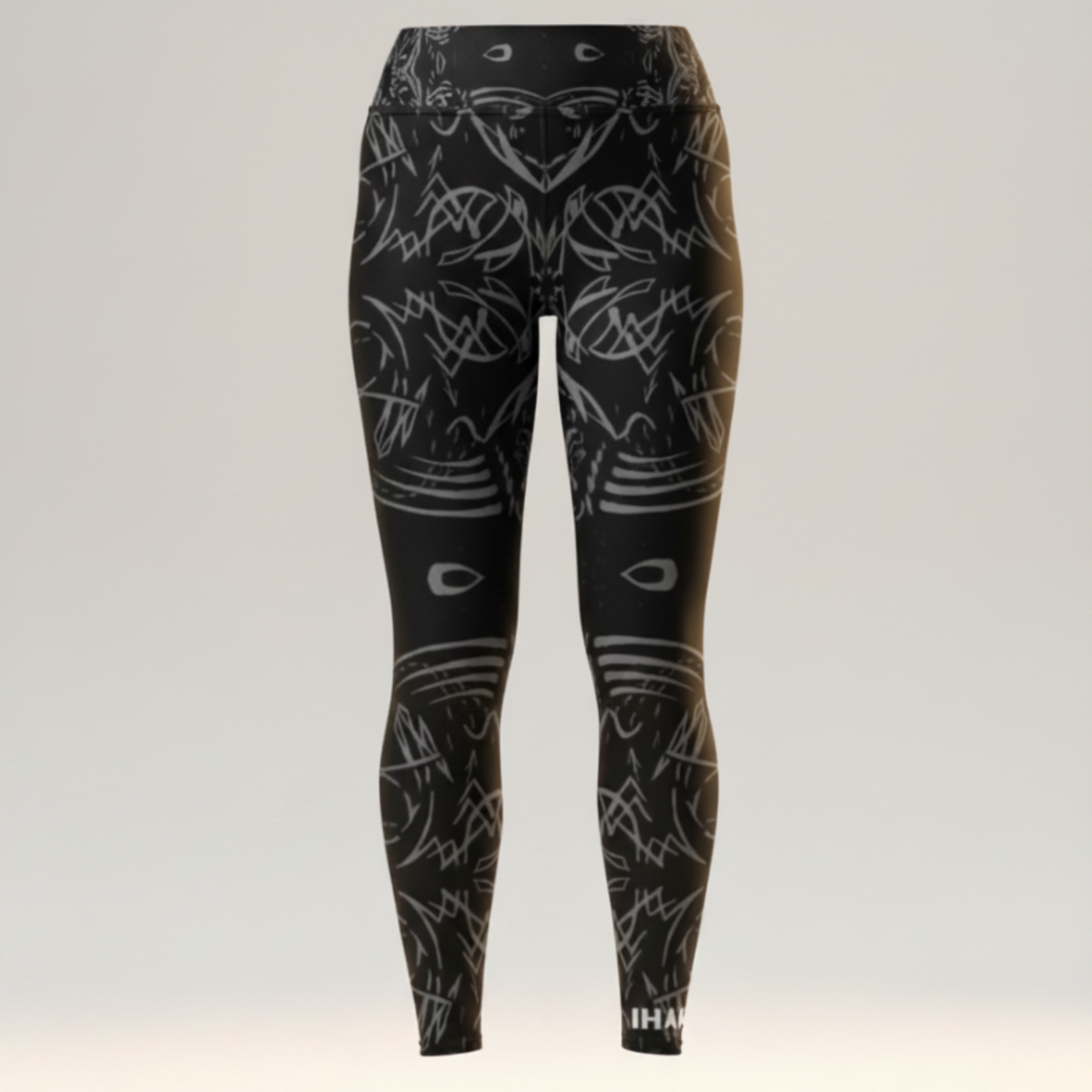 Black leggings with white abstract patterns on a light gray background
