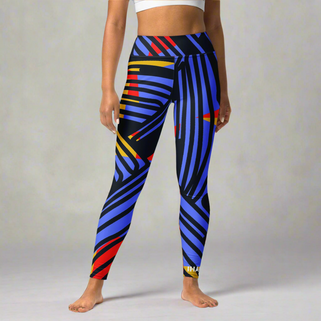 Saber print seamless high-waisted leggings, limited edition IHAMORA activewear XS–4XL. Woman wearing colorful striped leggings on a multicolored geometric background