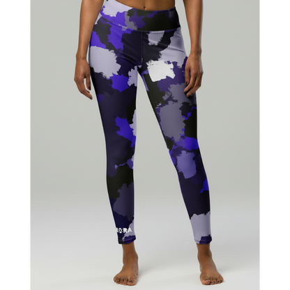 Person wearing purple camouflage leggings on a white background